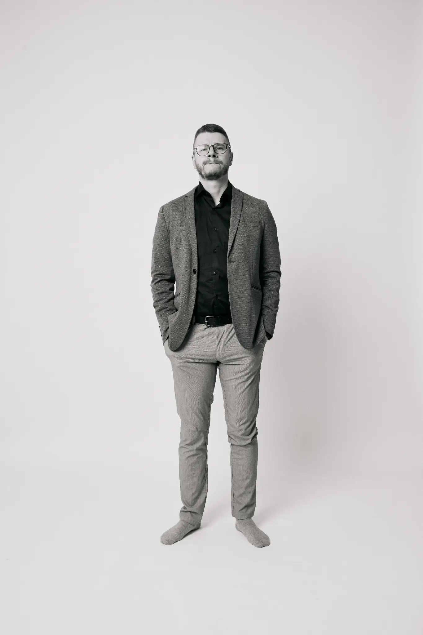 Oleg Abramov in a black and white studio portrait